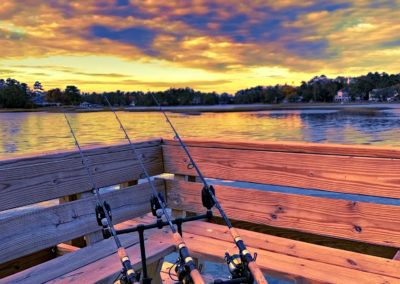 Chris Plaford - three fishing rods set up on a dock